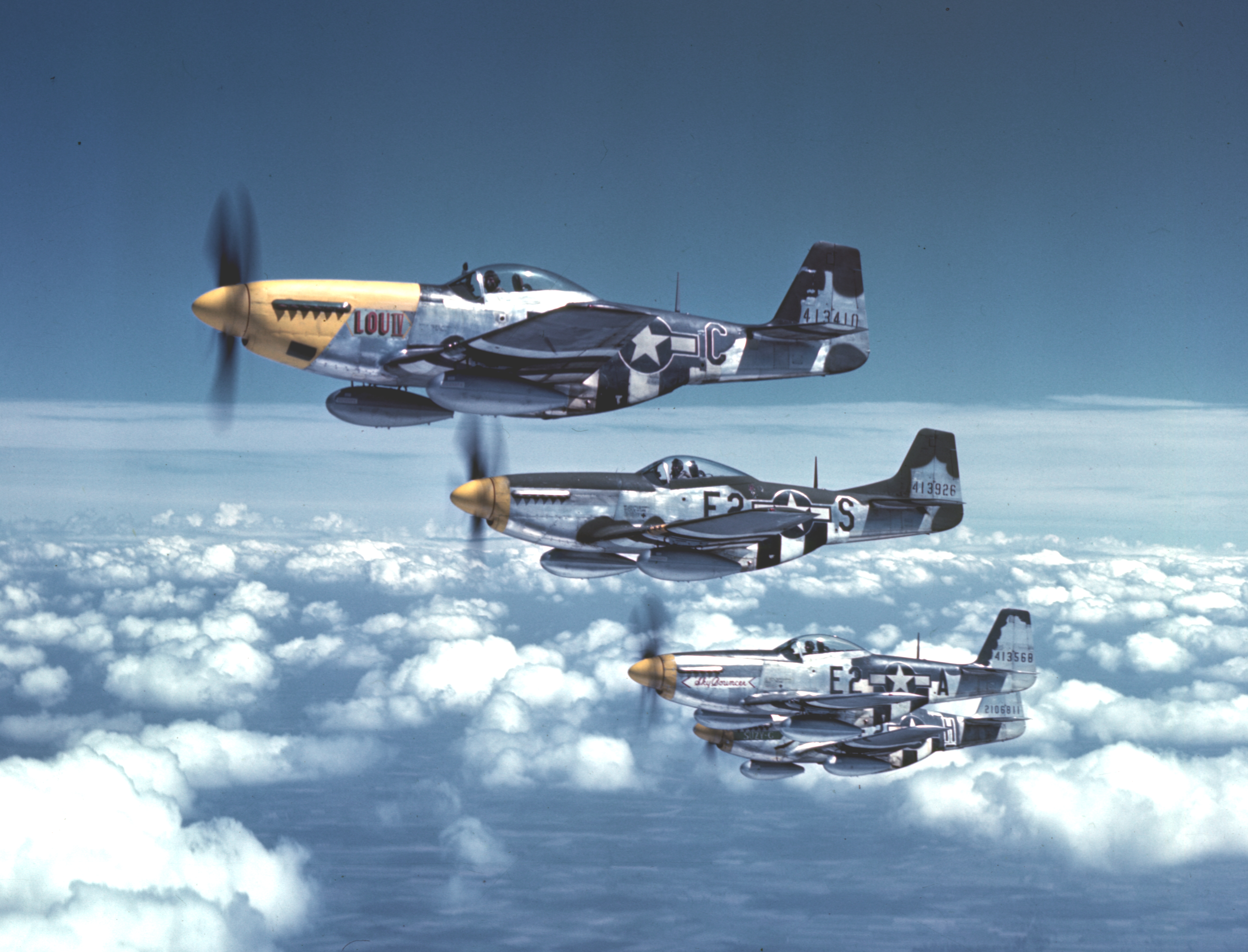 Bottisham Four" - Four P-51 Mustangs fighters in flight