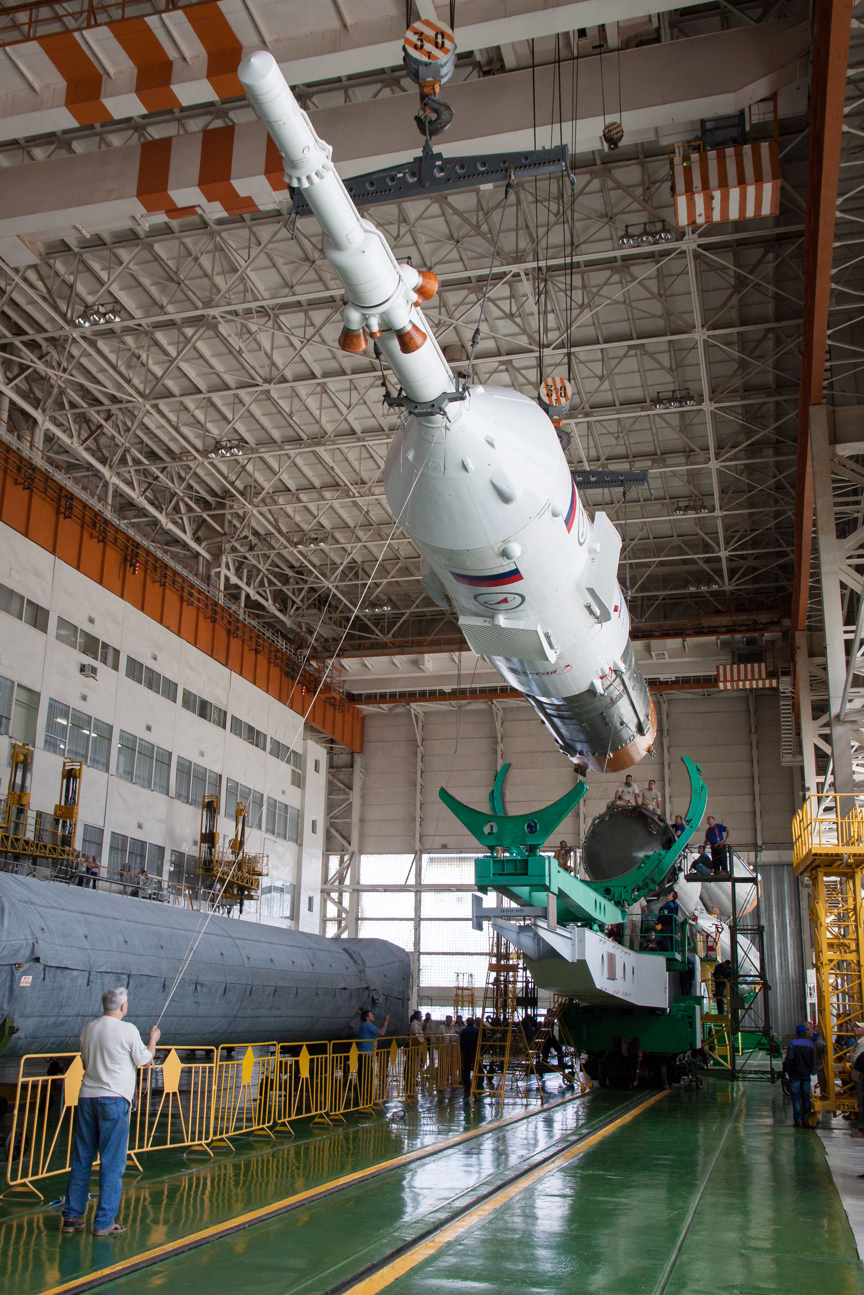 A Soyuz spacecraft being mated with the launch vehicle boosters