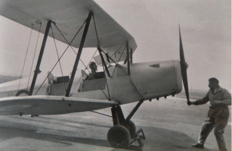 A woman piloting an airplane in the 1950's (ancestors picture)