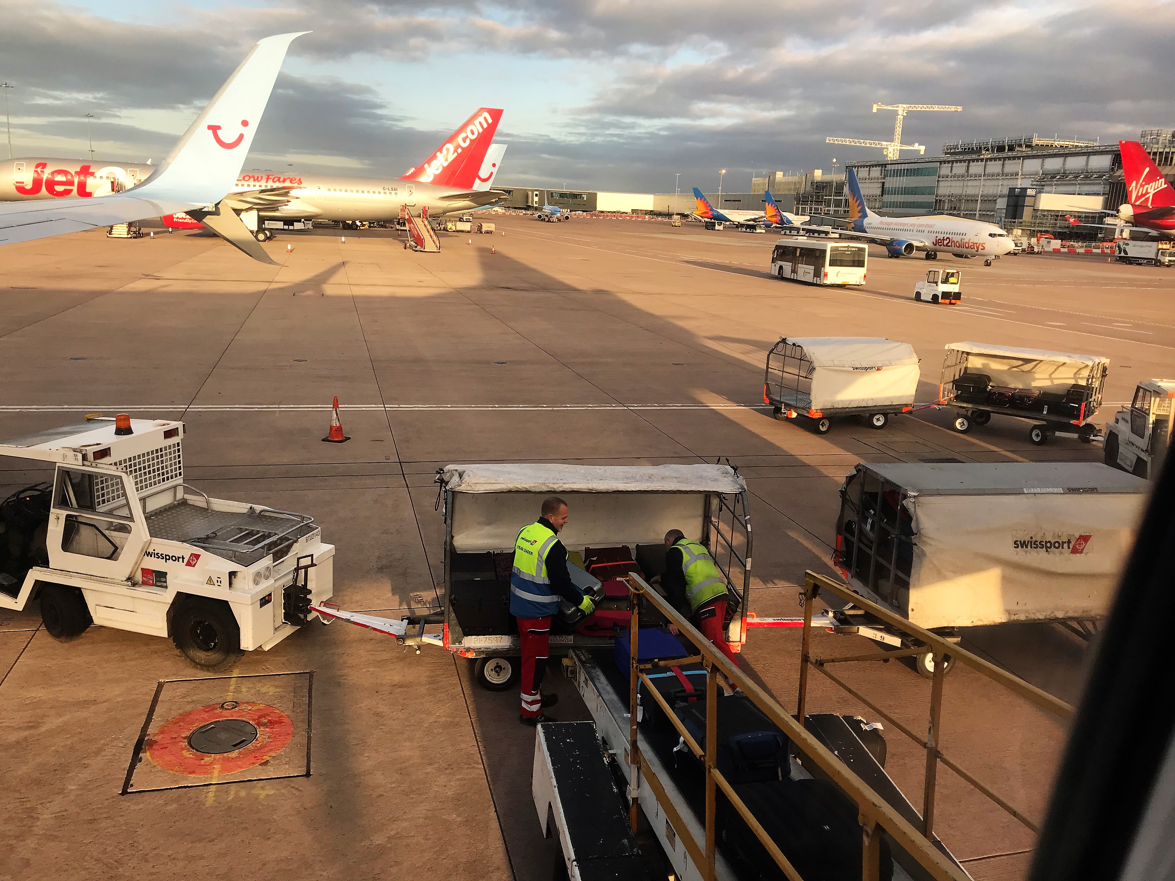 Baggage handlers loading a plane at Manchester Airport - geograph org uk