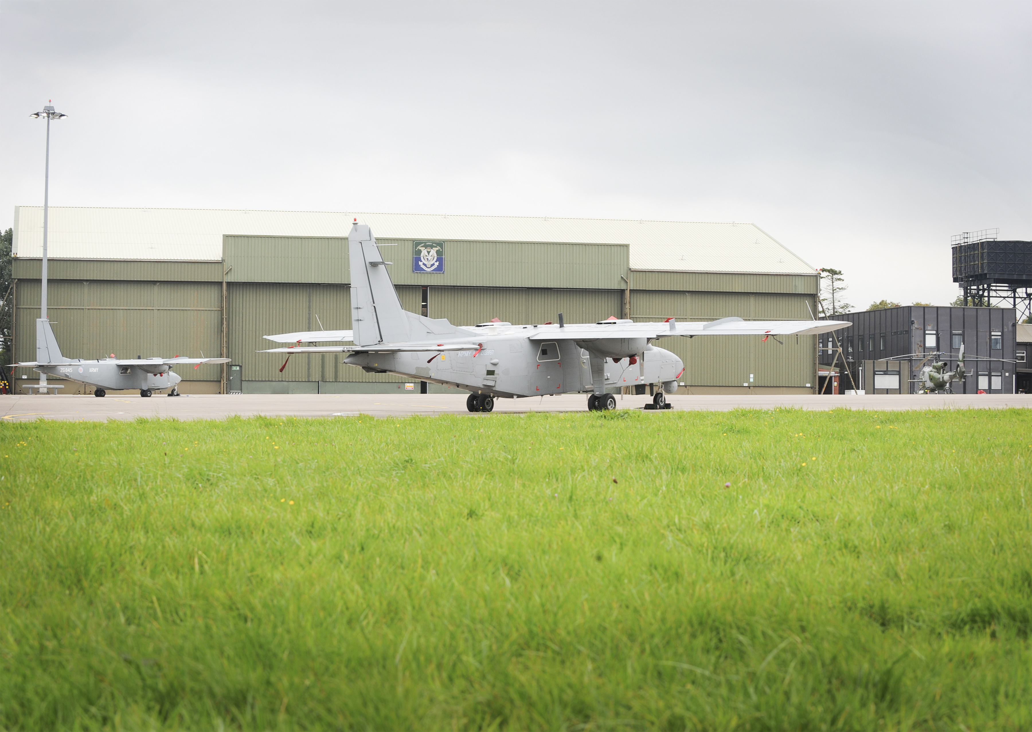 Britten Norman Defender 4000 aircraft and a Gazelle of the Army Air Corps at Aldergrove Flying Station