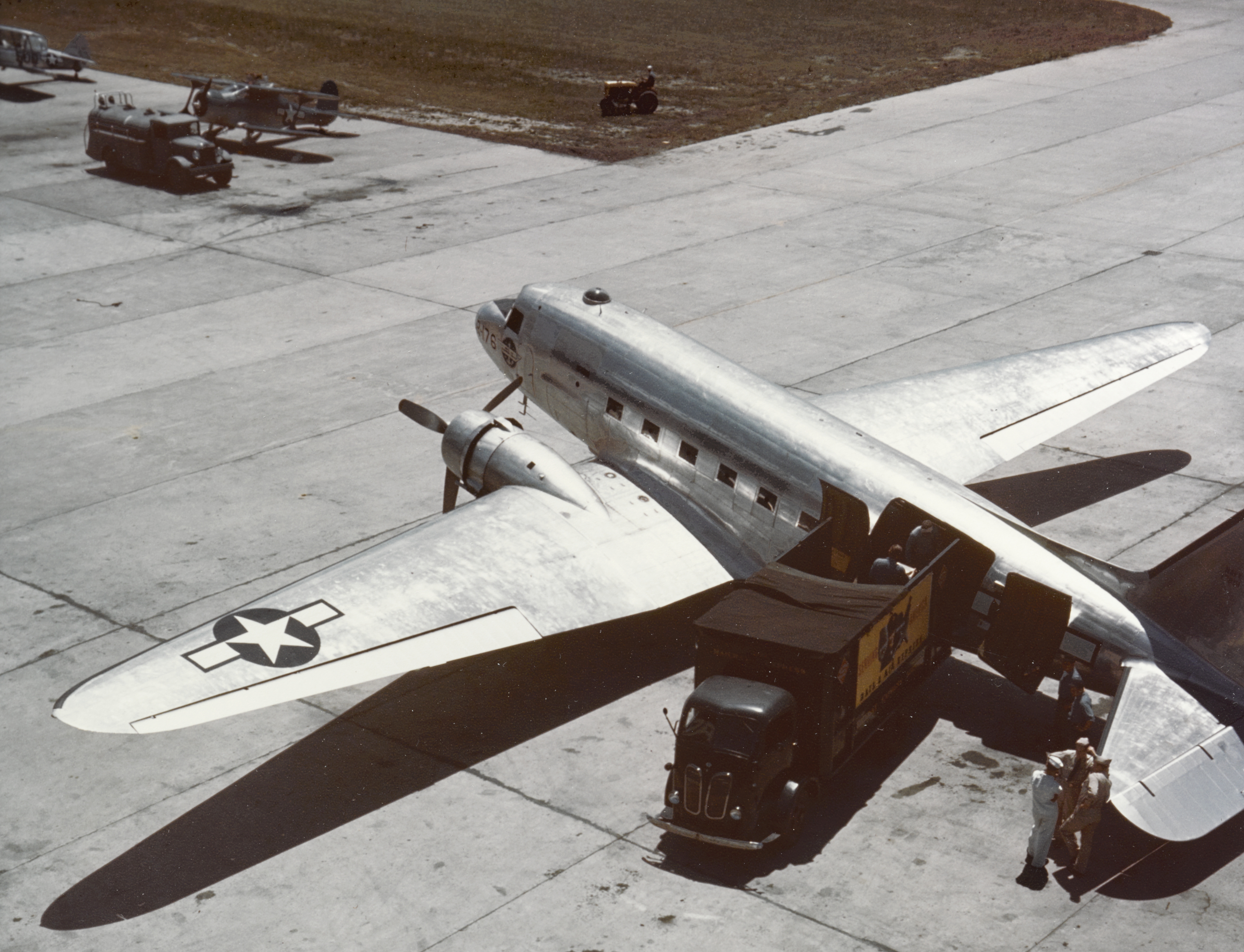 Douglas R4D-5 discharges high priority freight in the United States, circa 1943-45 (80 G K-13354)