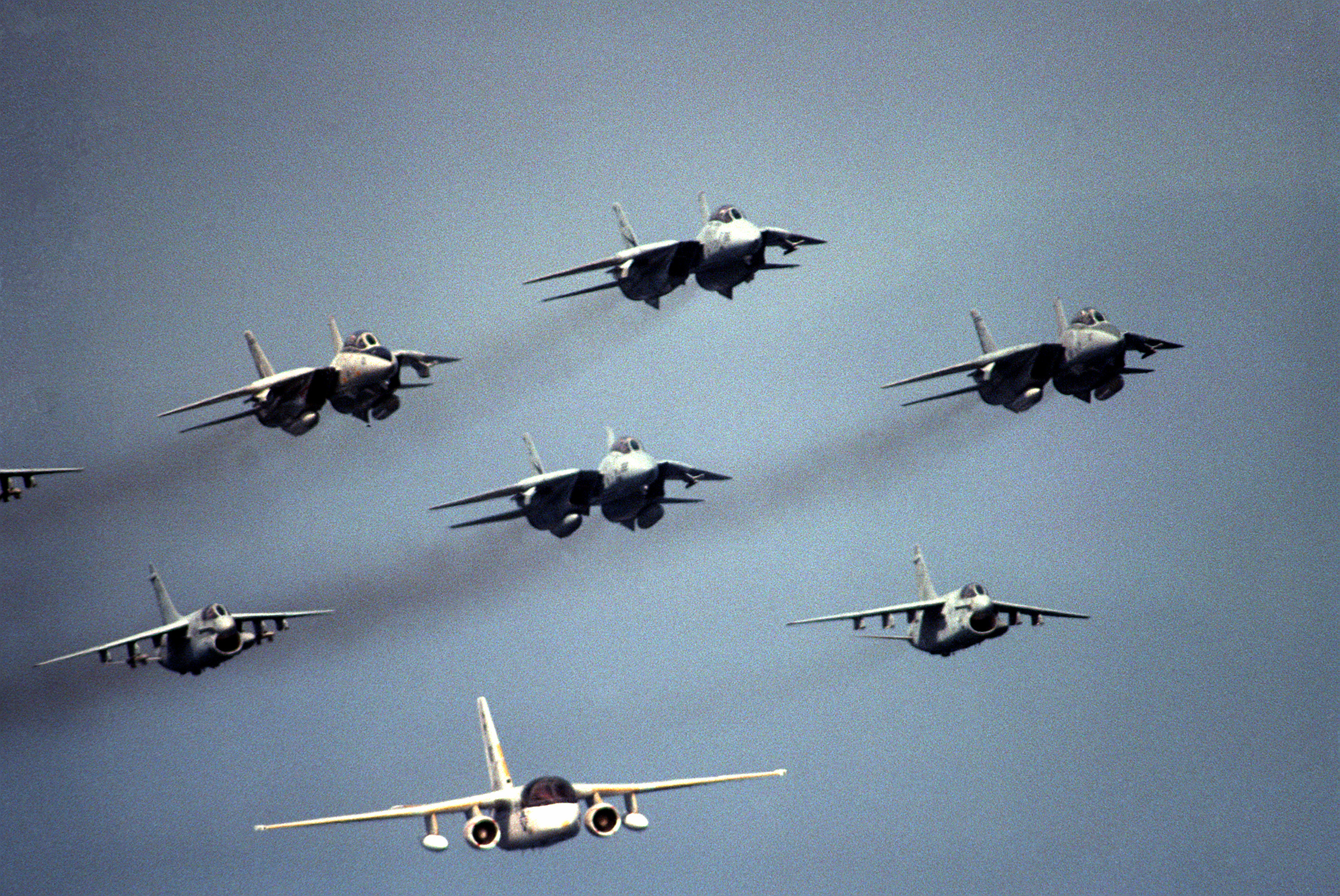 F-14 Tomcats, A-7E Corsairs and S-3 Viking aircraft of Carrier Air Wing 9 (CVN-9) fly in formation over the nuclear powered aircraft carrier USS NIMITZ (CVN-68) during a visit by th - DPLA - dfe24c6430 fcf899ff0196f57dc25218