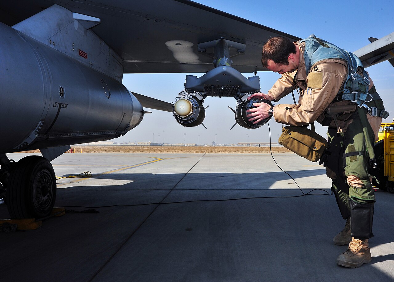 F-16 with weapons and hardpoints under the wings