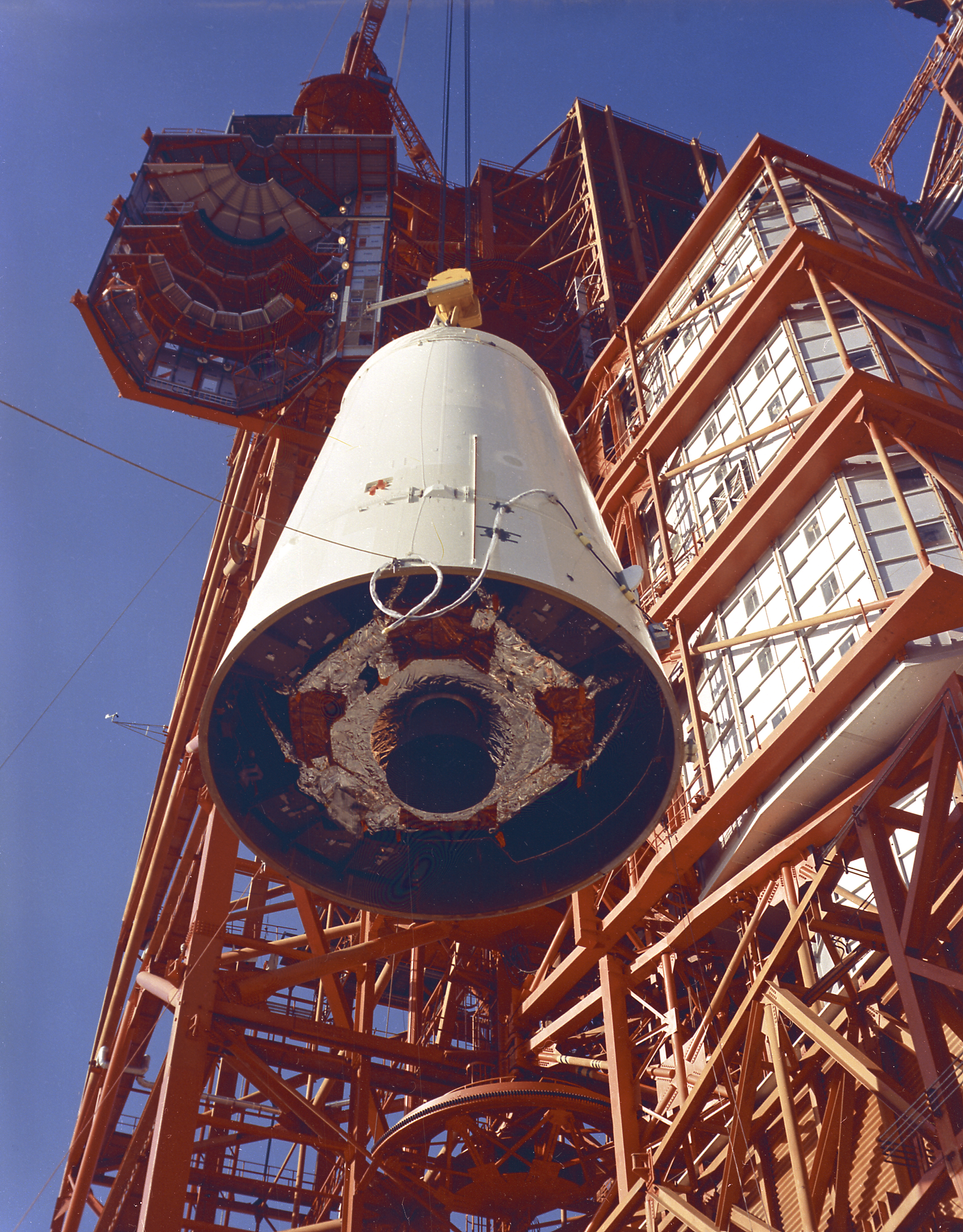 Workers hoist the SLA adapter during assembly of the 204LM 1
