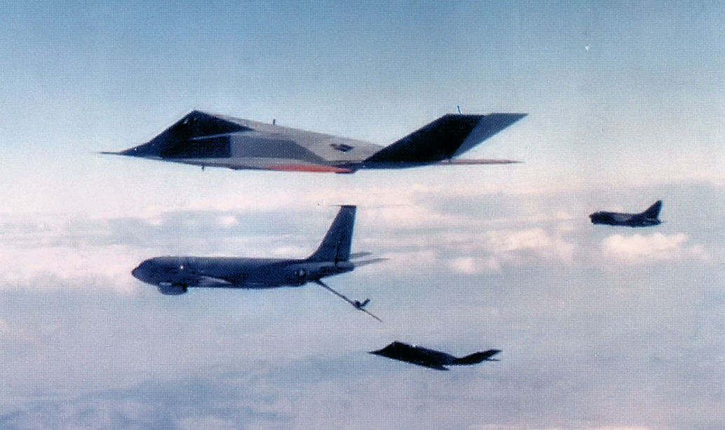 In-flight refueling of an F-117 from the 4450th Tactical Group (secret unit based at Tonopah), escorted by an A-7D
