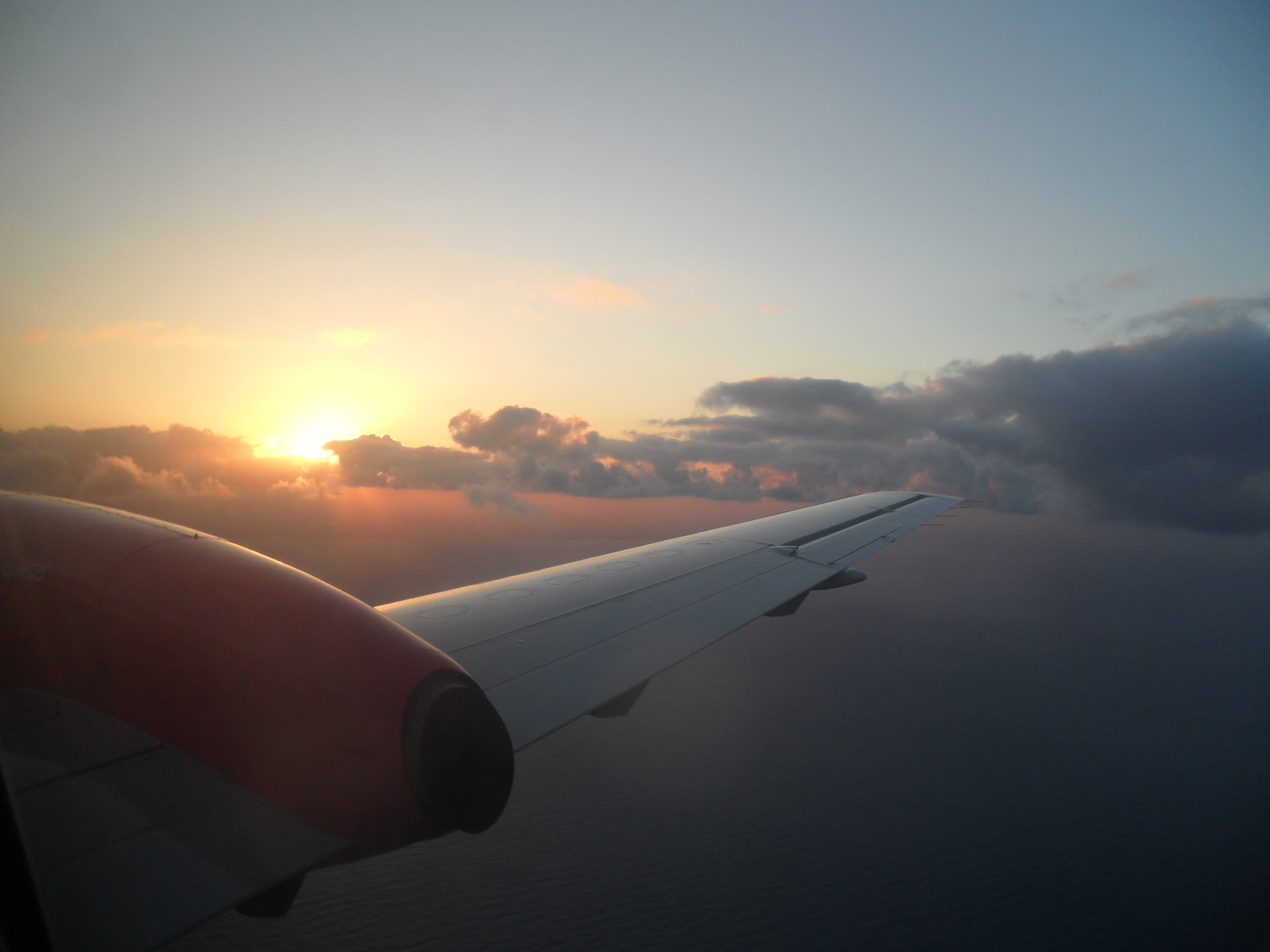 Silver Airways Saab 340 Aircraft Cabin Window View at Sunset