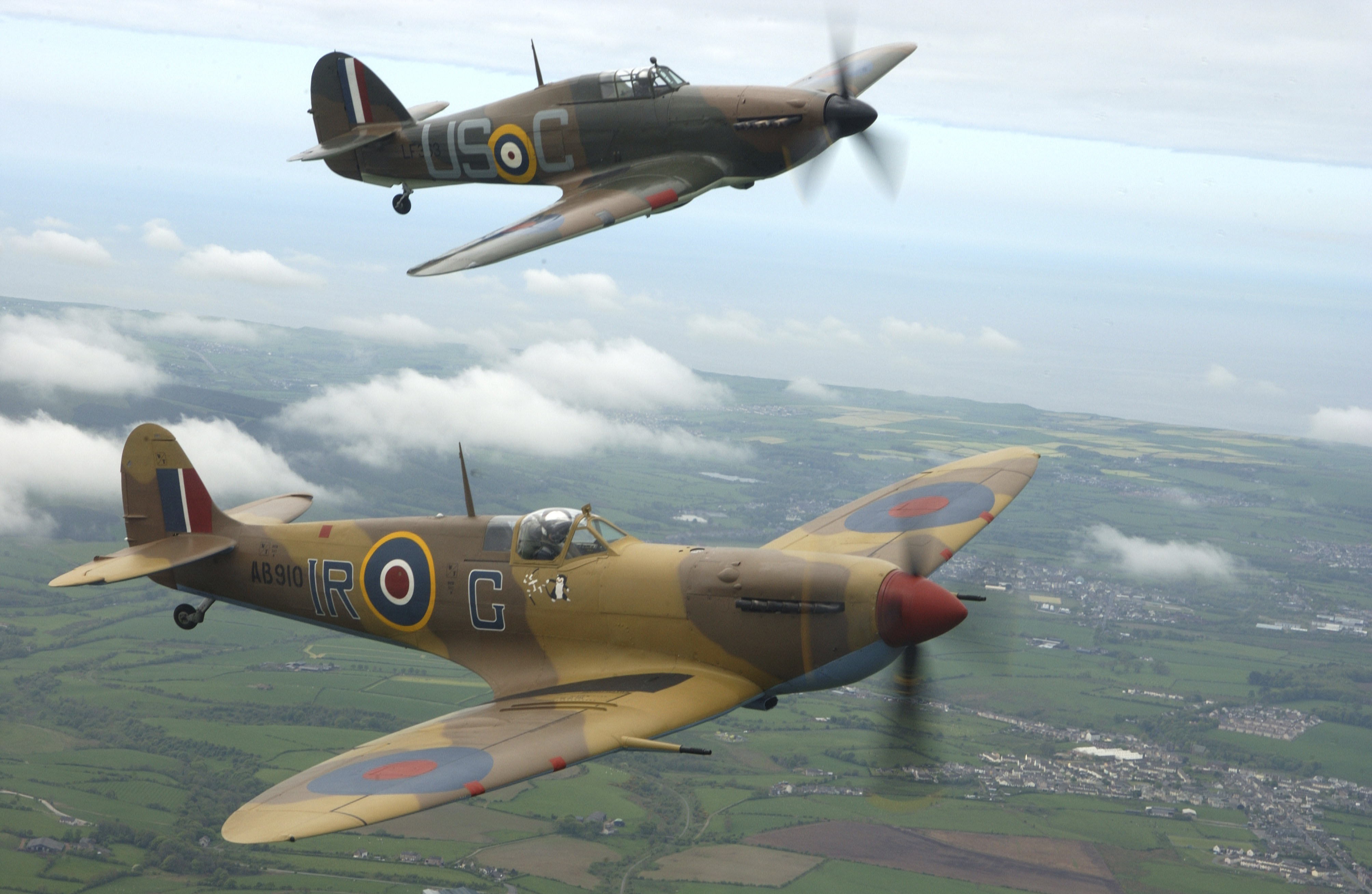 Spitfire and Hurricane of the Battle of Britain Memorial Flight in close formation over the Lancashire coast