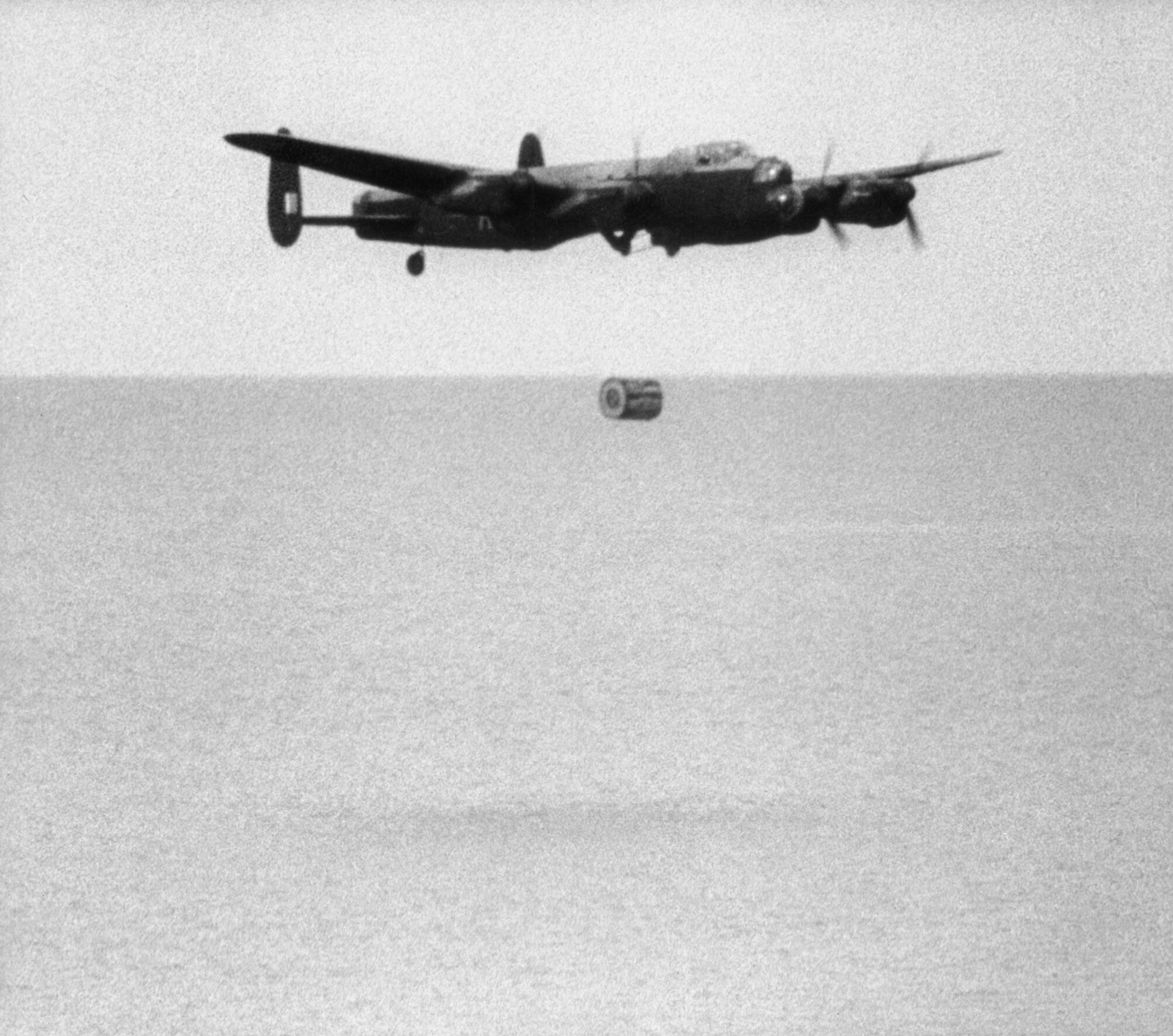 Upkeep weapon falling from a No. 617 Squadron Lancaster during trials at the Reculver bombing range
