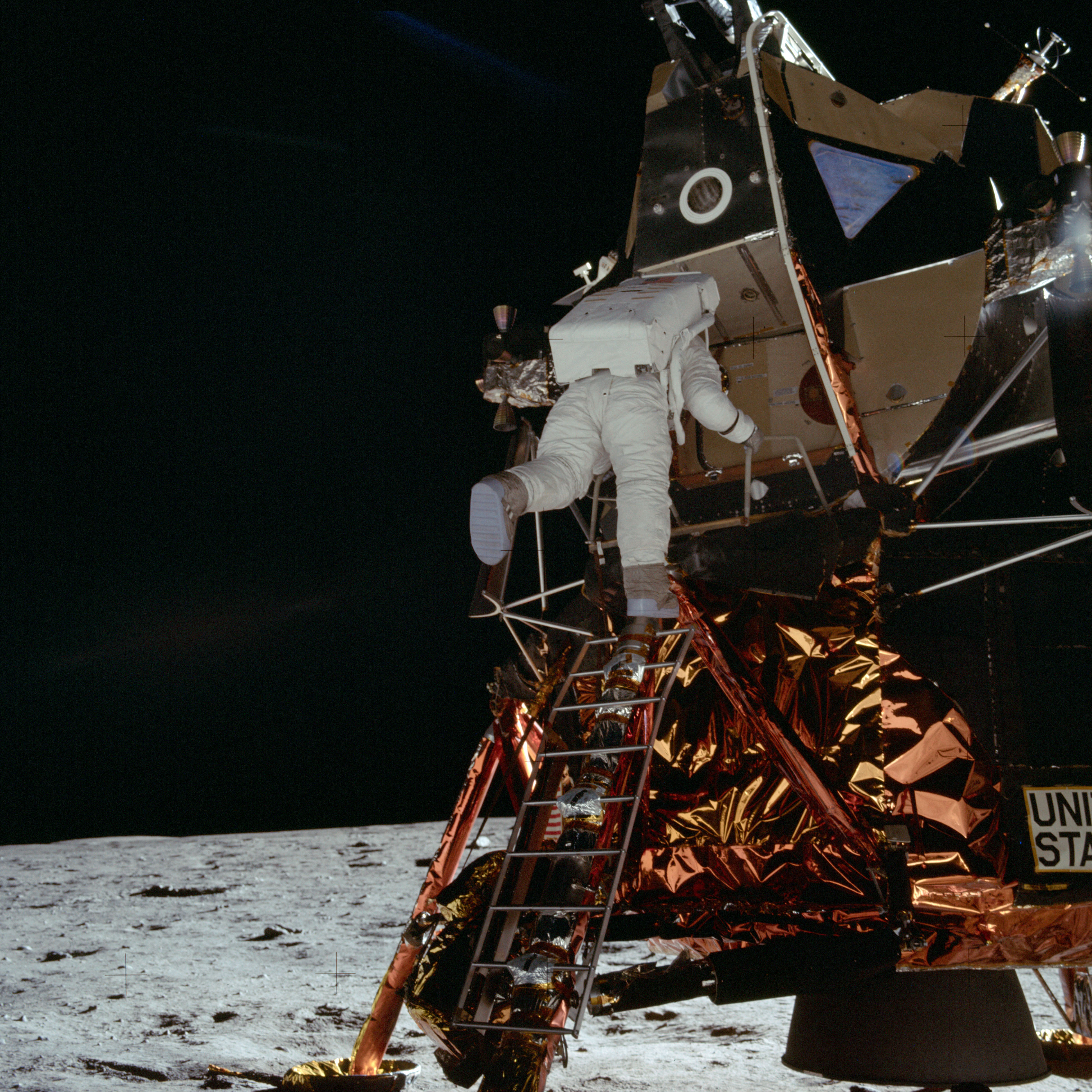 Aldrin descends the Lunar Module ladder to the lunar surface