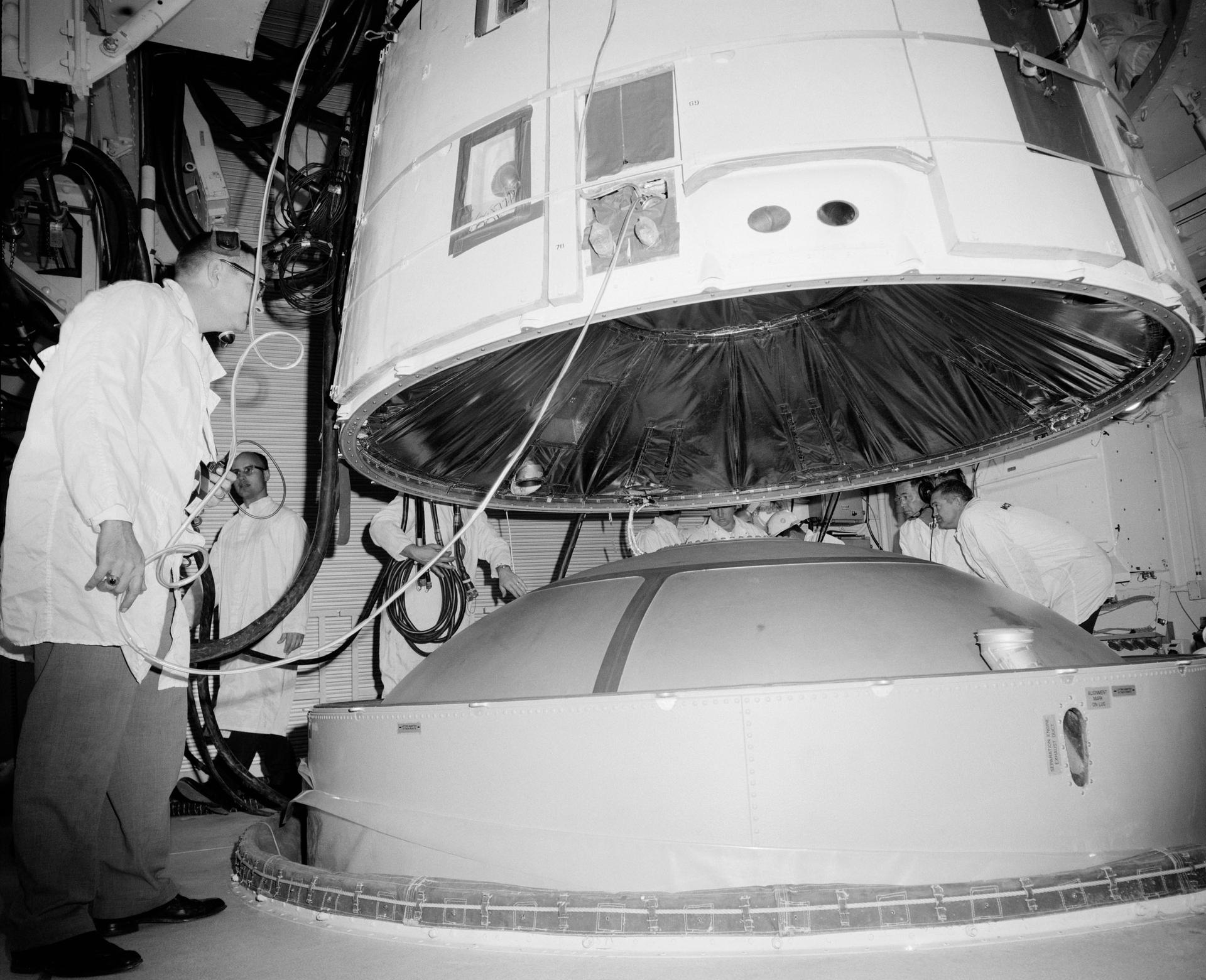 Mating the Gemini 3 spacecraft to its Titan II in the white room of Pad 19