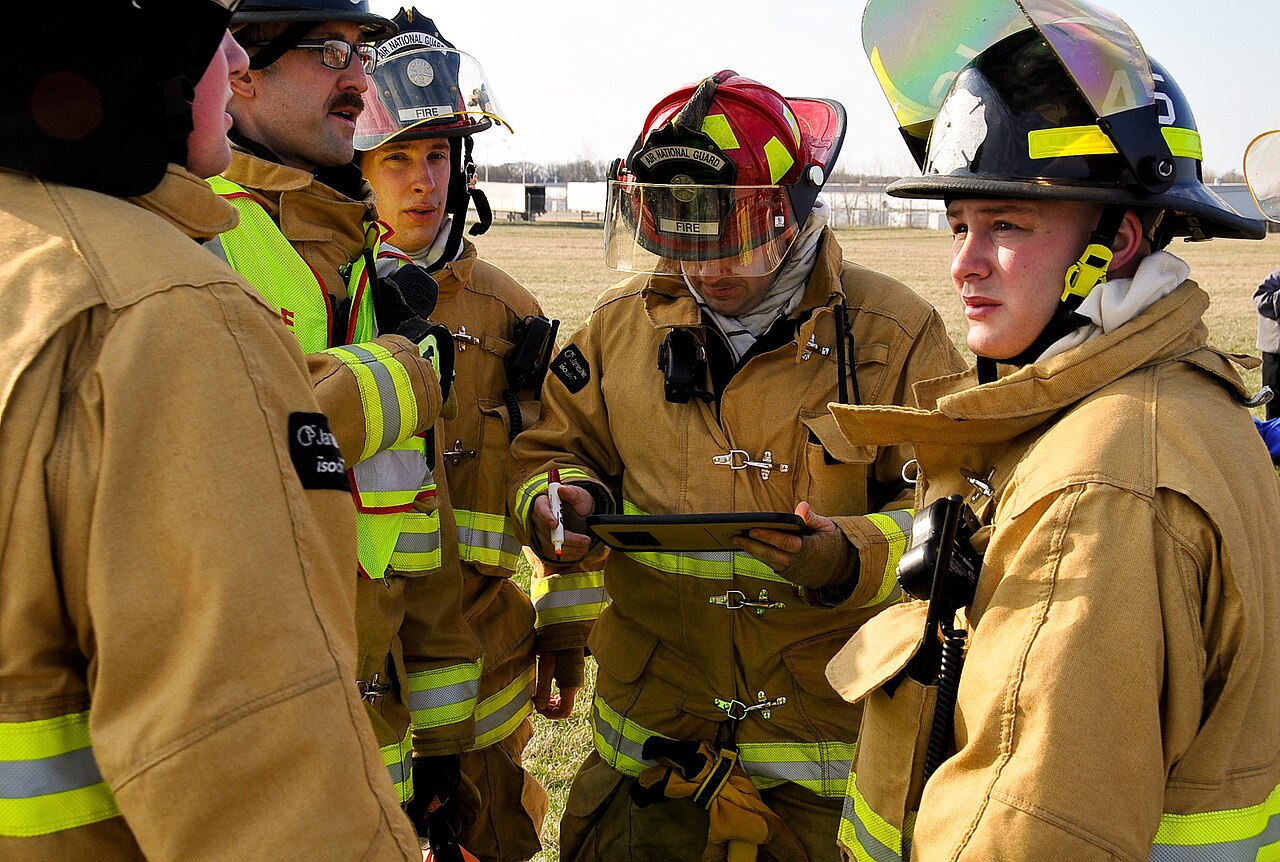 Firefighters coordinate the response during an aircraft accident drill.