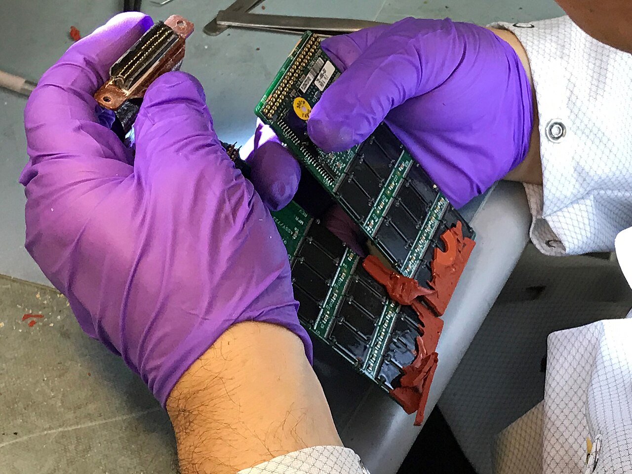Memory boards from a cockpit voice recorder on a technical laboratory bench.