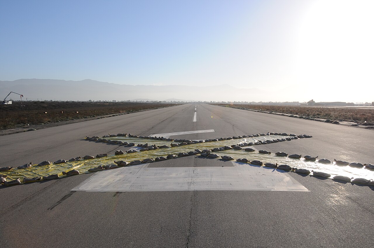 Painted cross marking a runway closed to traffic.