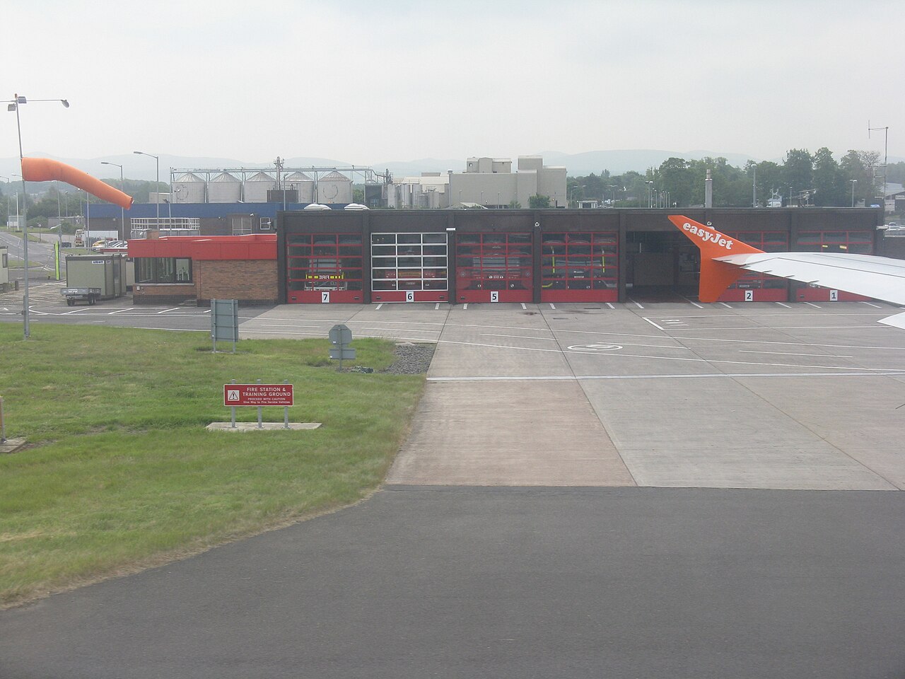 Airport fire station with its training ground.