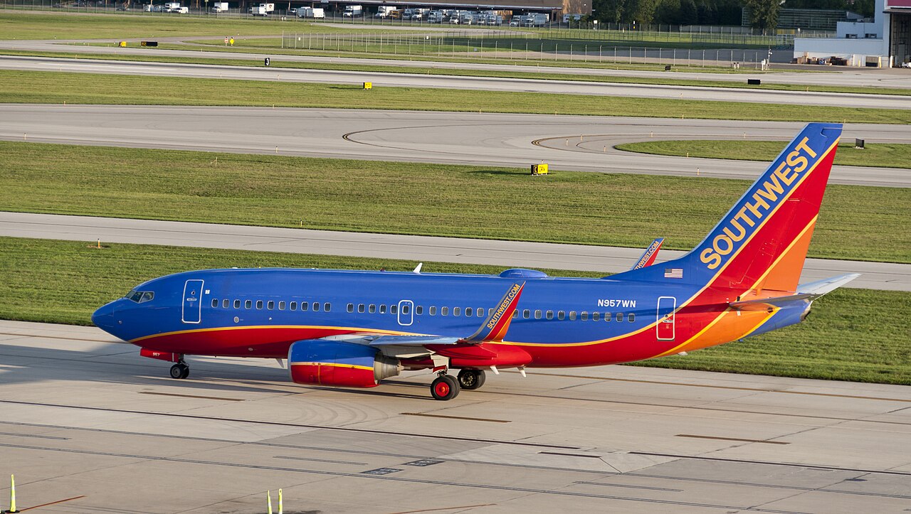 Southwest Airlines Boeing 737-700 lining up for takeoff at dusk.