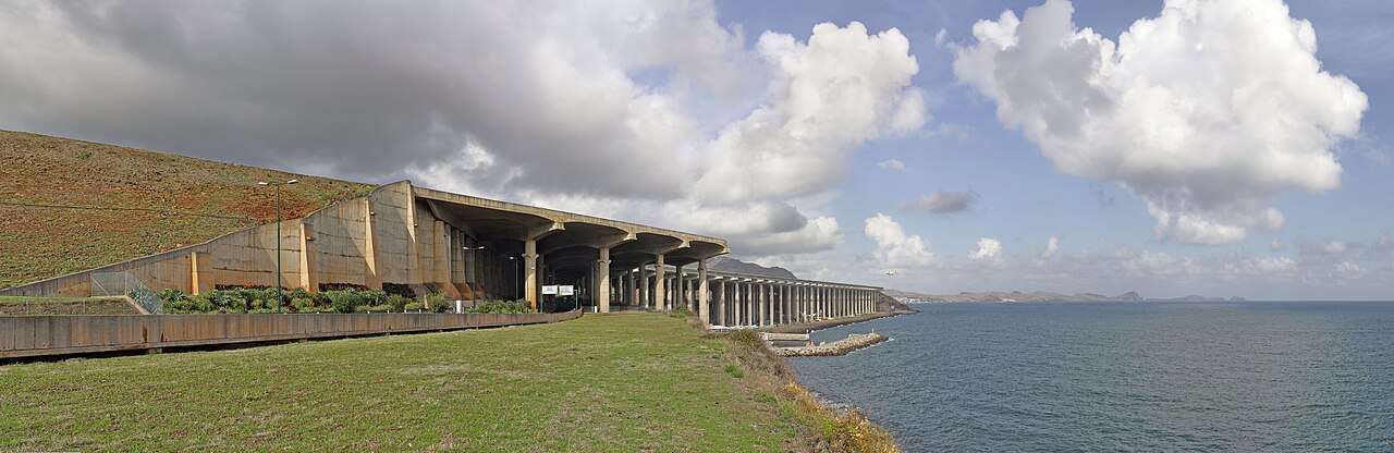 Madeira Airport runway carried on concrete pillars beside the sea.