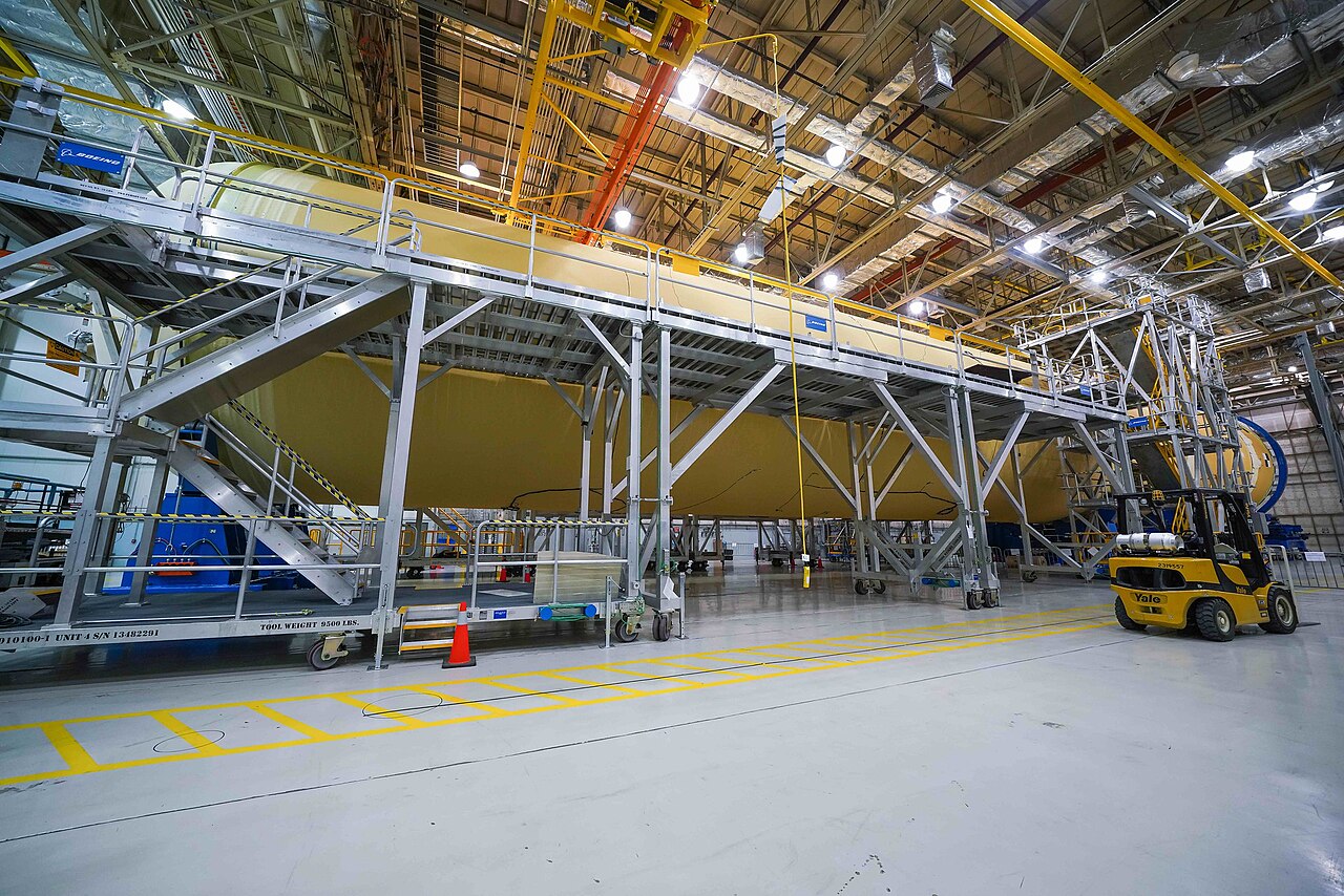 Joining the large structural sections of a rocket core stage in the assembly building.