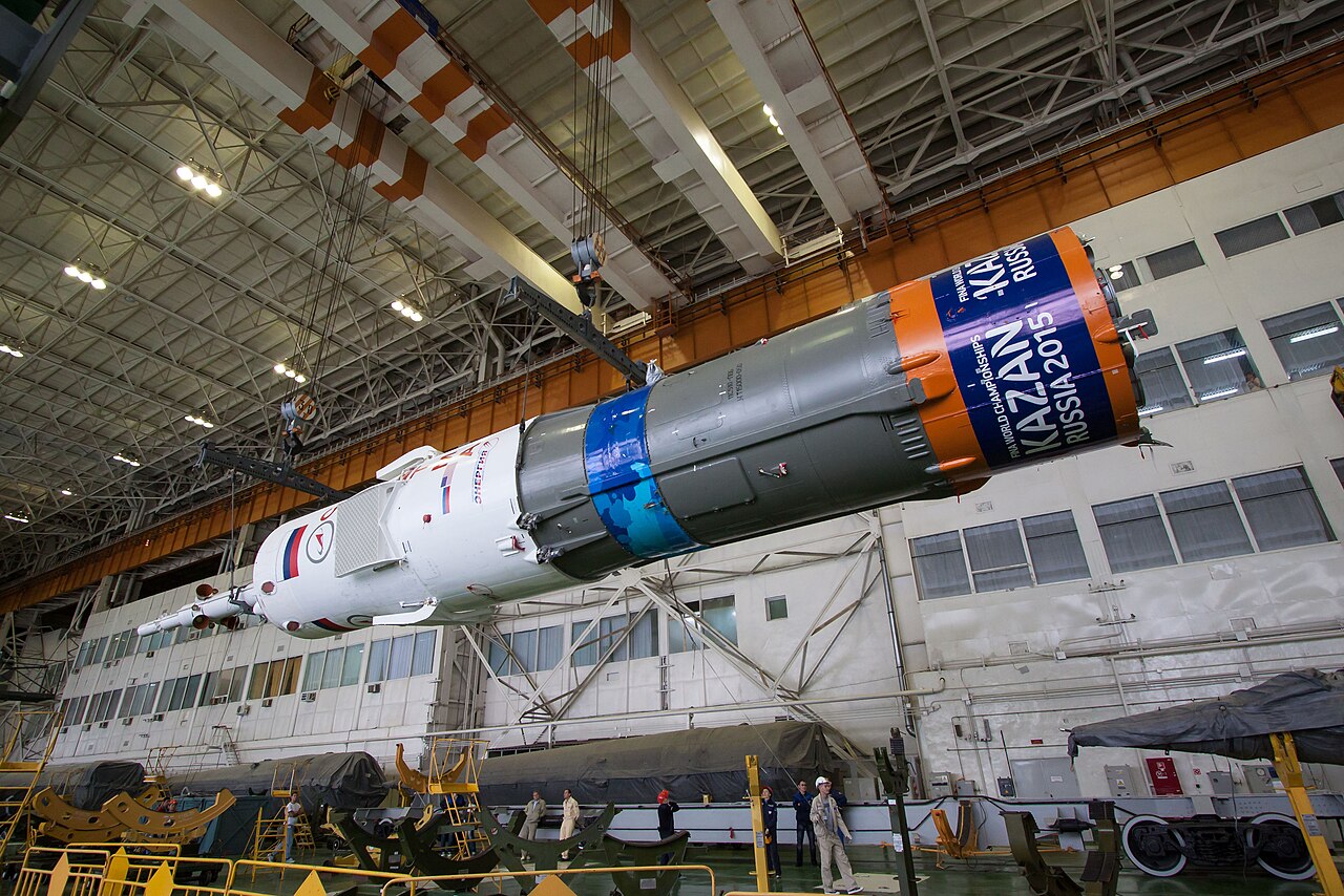 Soyuz rocket undergoing horizontal integration inside the cosmodrome assembly building.