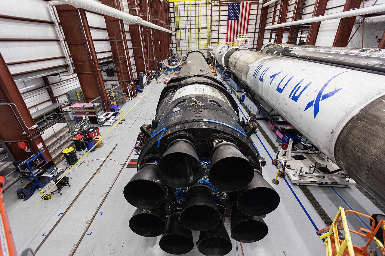 Rocket boosters lined up inside the integration hangar of a launch complex.