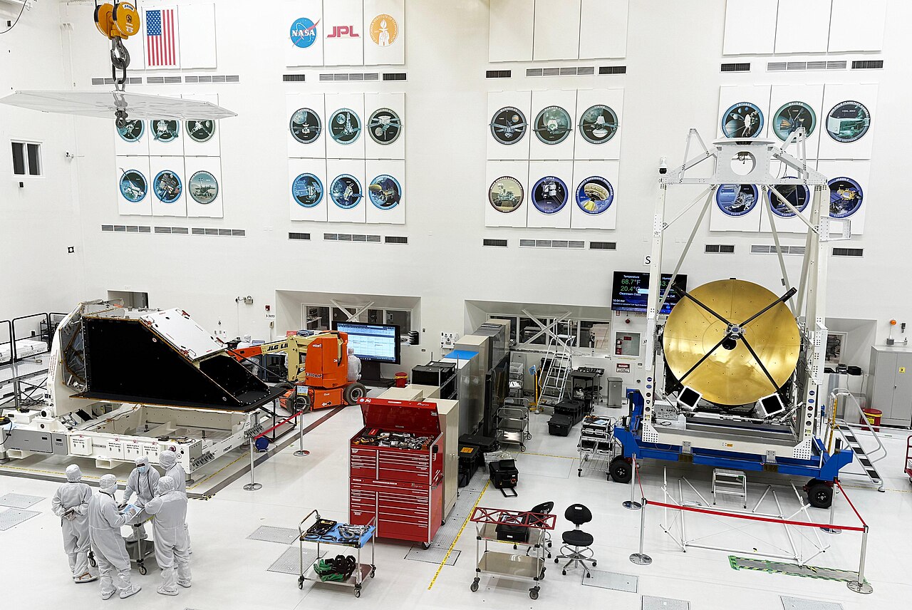 Spacecraft integration clean room with two instruments under preparation.