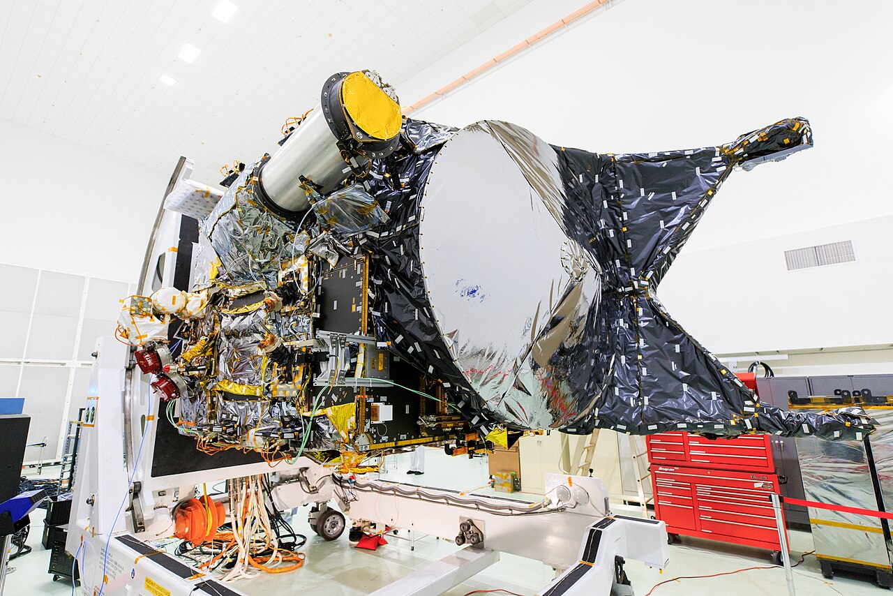 Space probe wrapped in multilayer insulation in a clean room before launch.