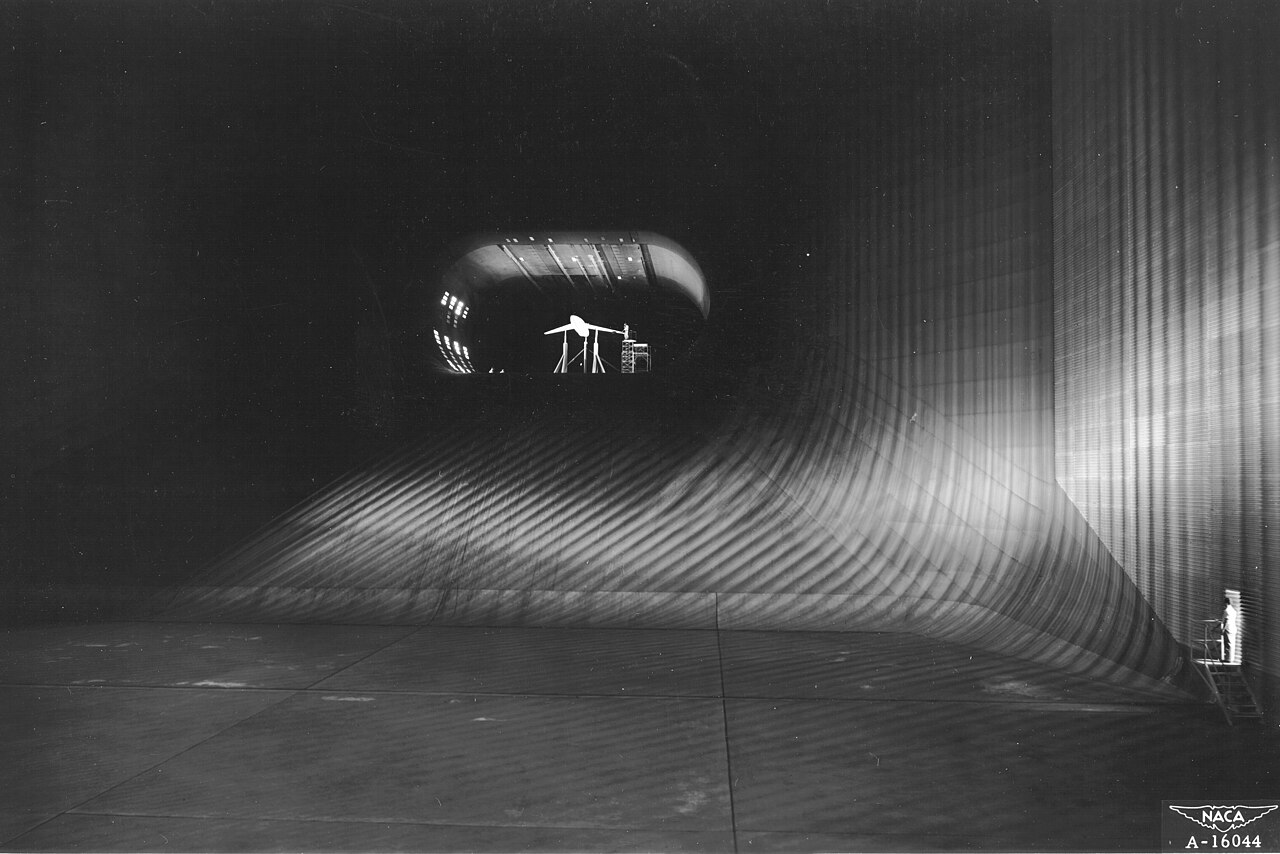 View down the throat of a huge aeronautical wind tunnel.