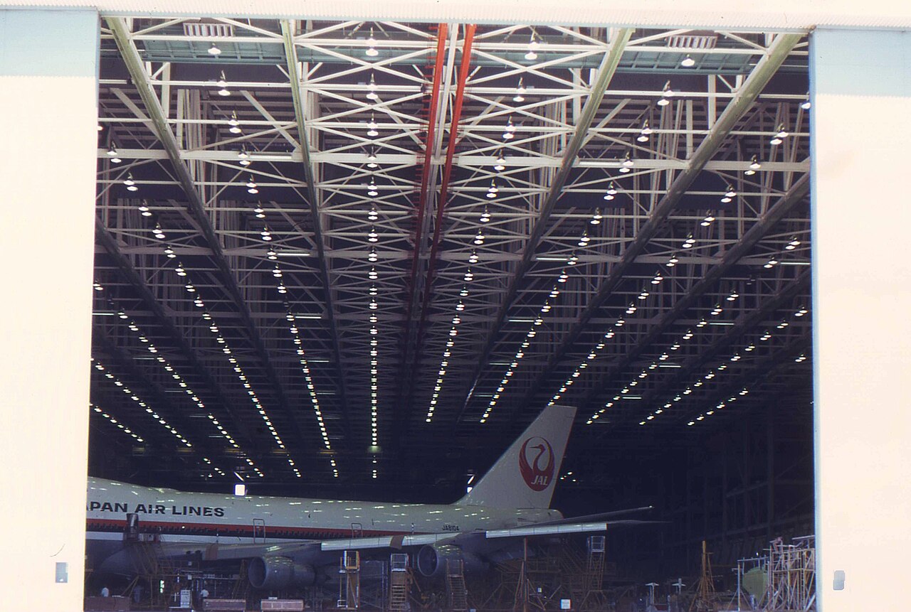 Interior of the Boeing Everett factory with a widebody airliner under work.