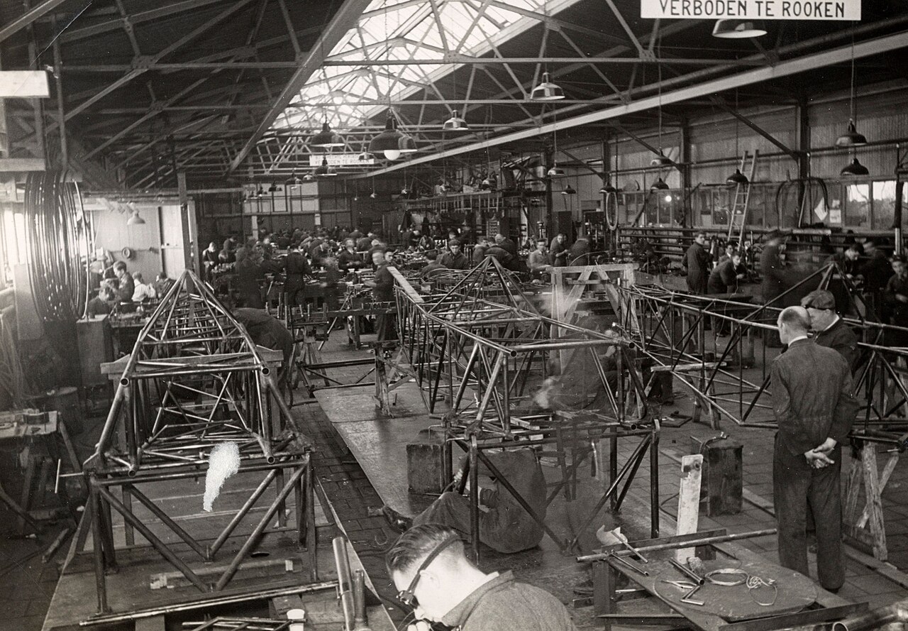 Welding steel-tube fuselages in the assembly hall of an aircraft factory.