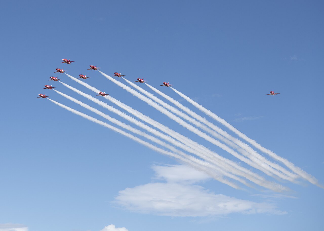 The Royal Air Force Red Arrows aerobatic team flies in formation.