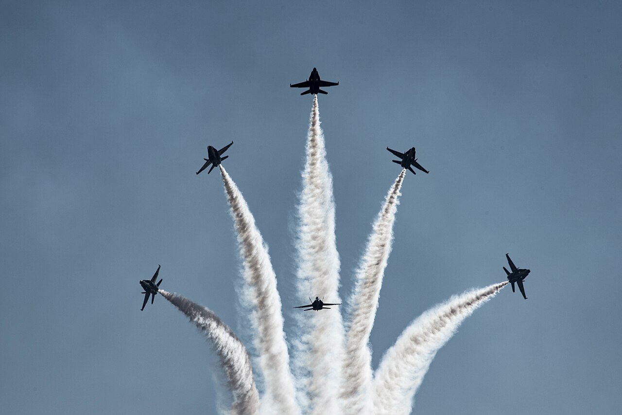 F/A-18 jets of the Blue Angels aerobatic team during an aerial display.