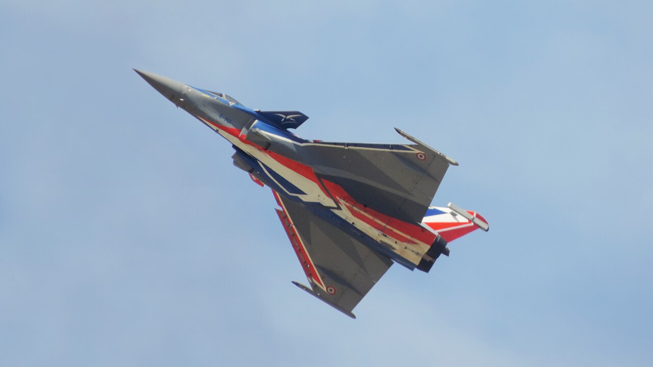 A Dassault Rafale fighter in flight during an aerospace show.