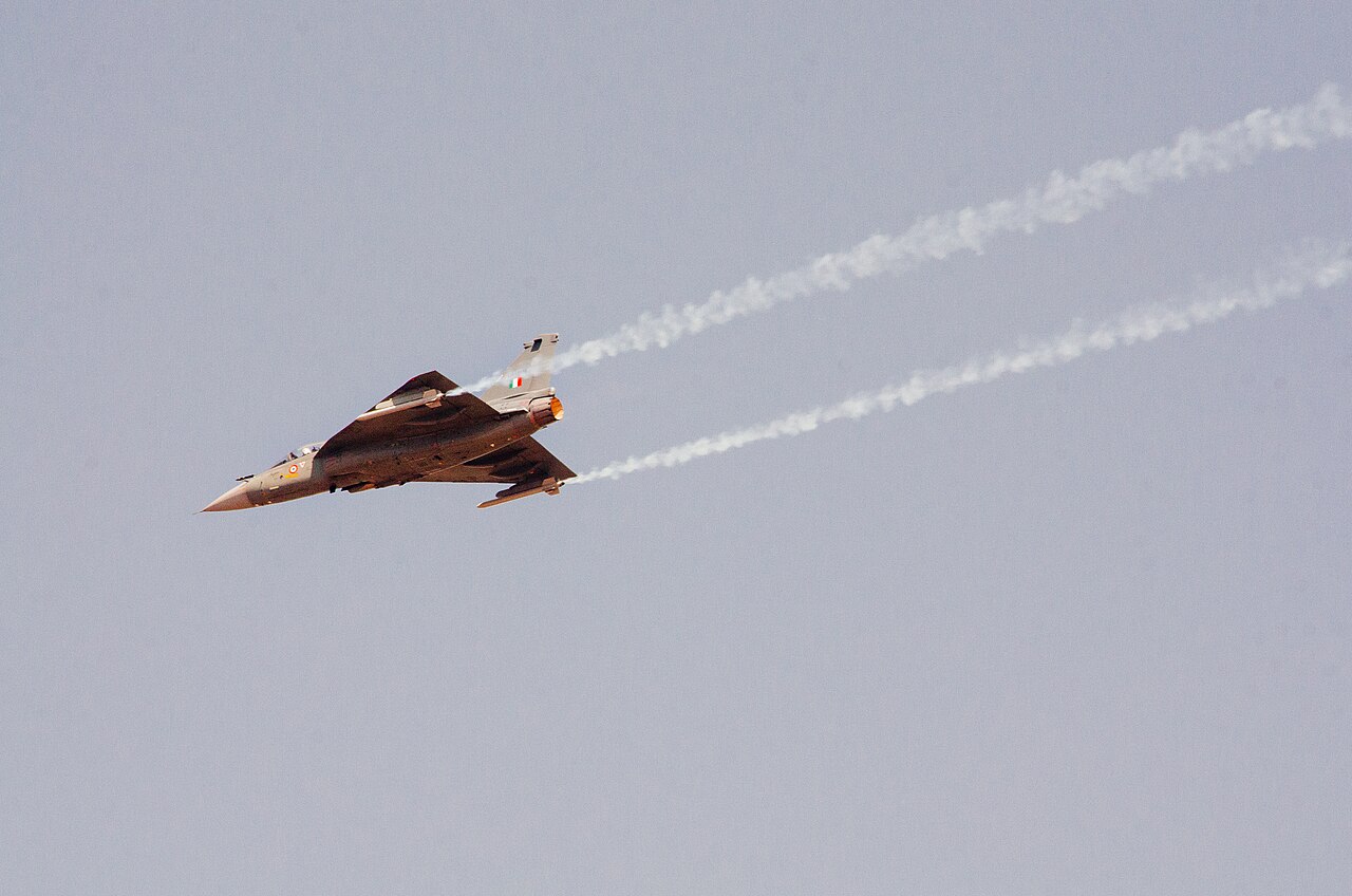A HAL Tejas light combat aircraft in flight during an air show.