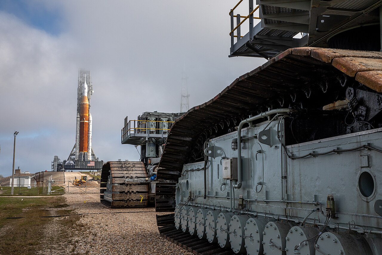 The SLS rocket and Orion spacecraft arrive at Launch Pad 39B atop the mobile launcher.