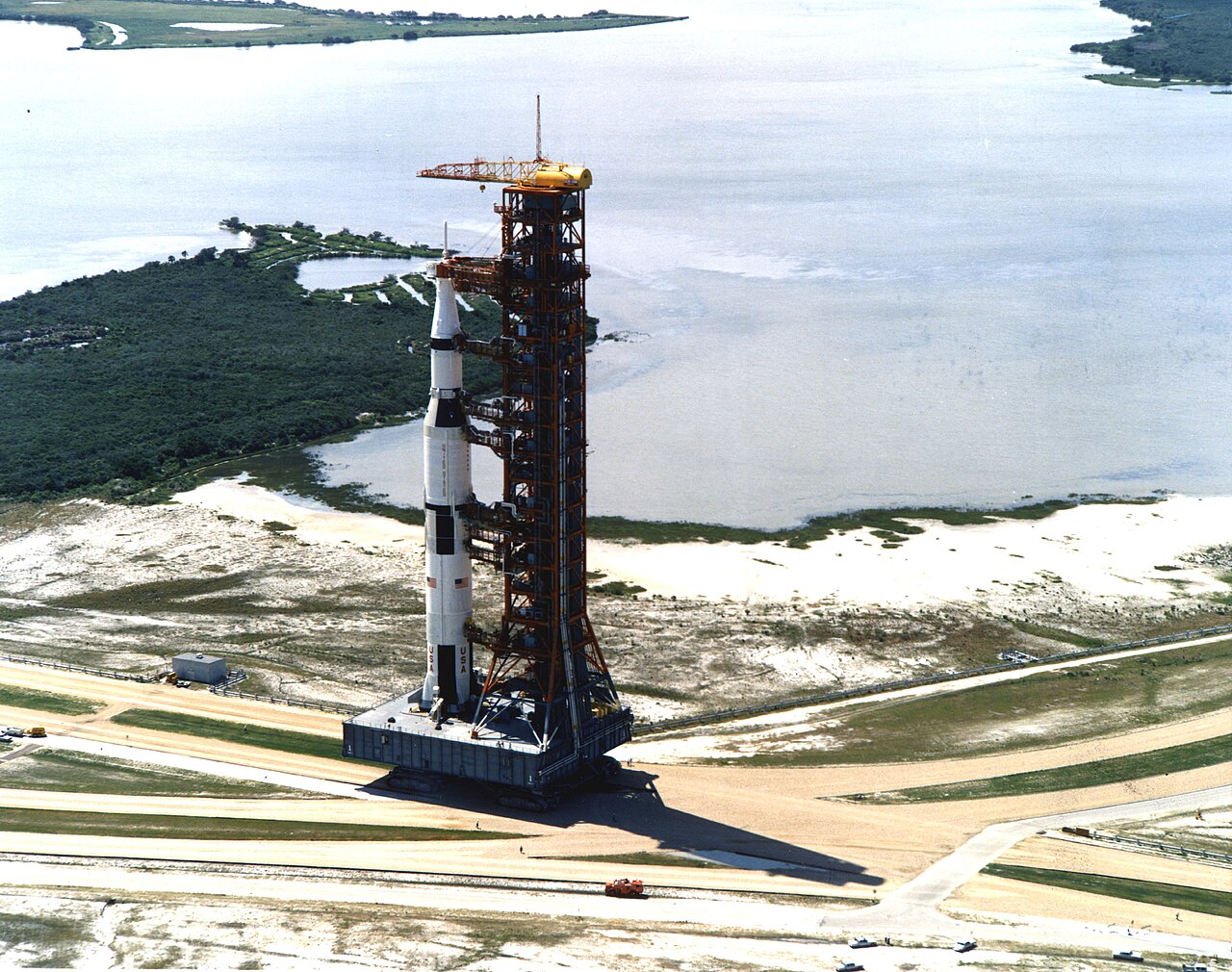 The crawler-transporter carries the Apollo 11 Saturn V rocket to Launch Complex 39A.