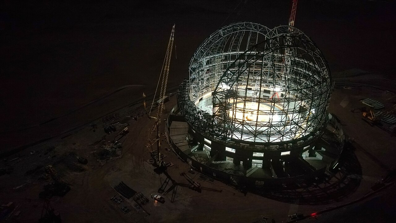 Dome of a large telescope under the night sky.