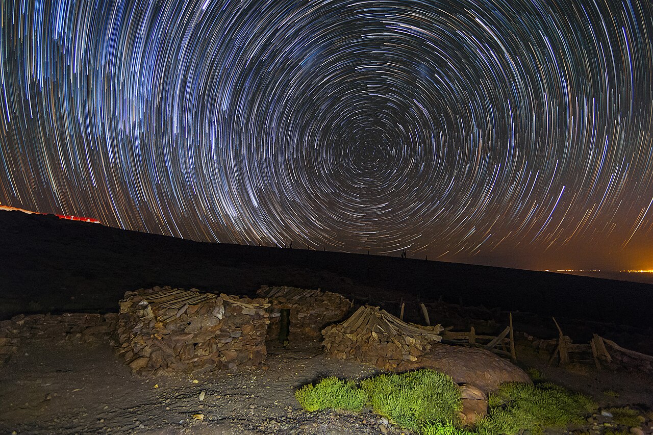 Circular star trails in a long-exposure night photograph.